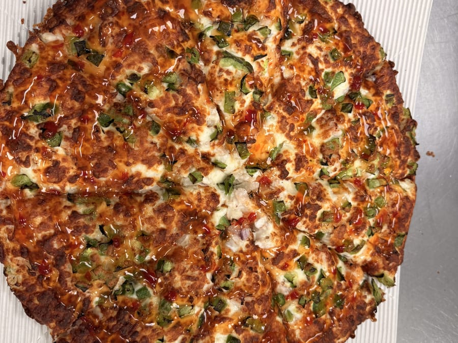 Veggie pizza with green peppers and onions